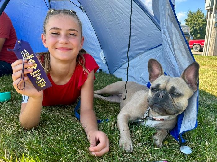 girl posing with dog 