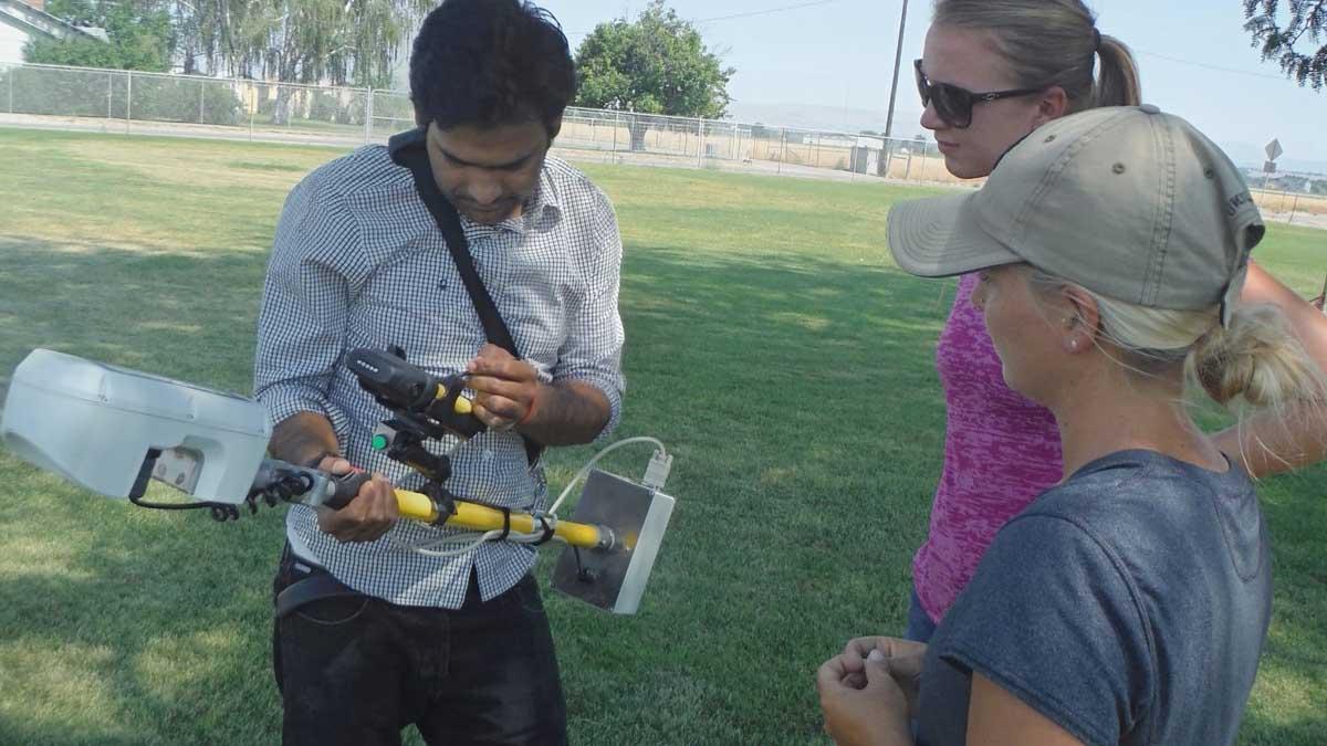 researcher with a device